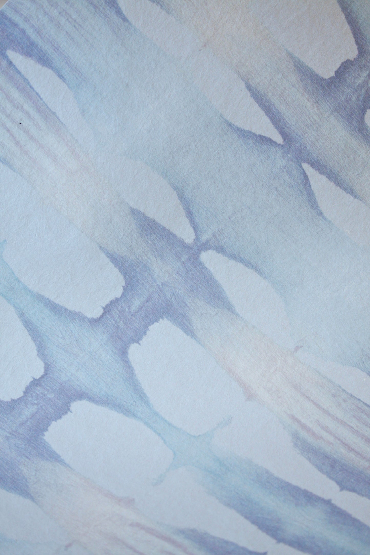 Abstract pattern of blue and white shapes on a textured background