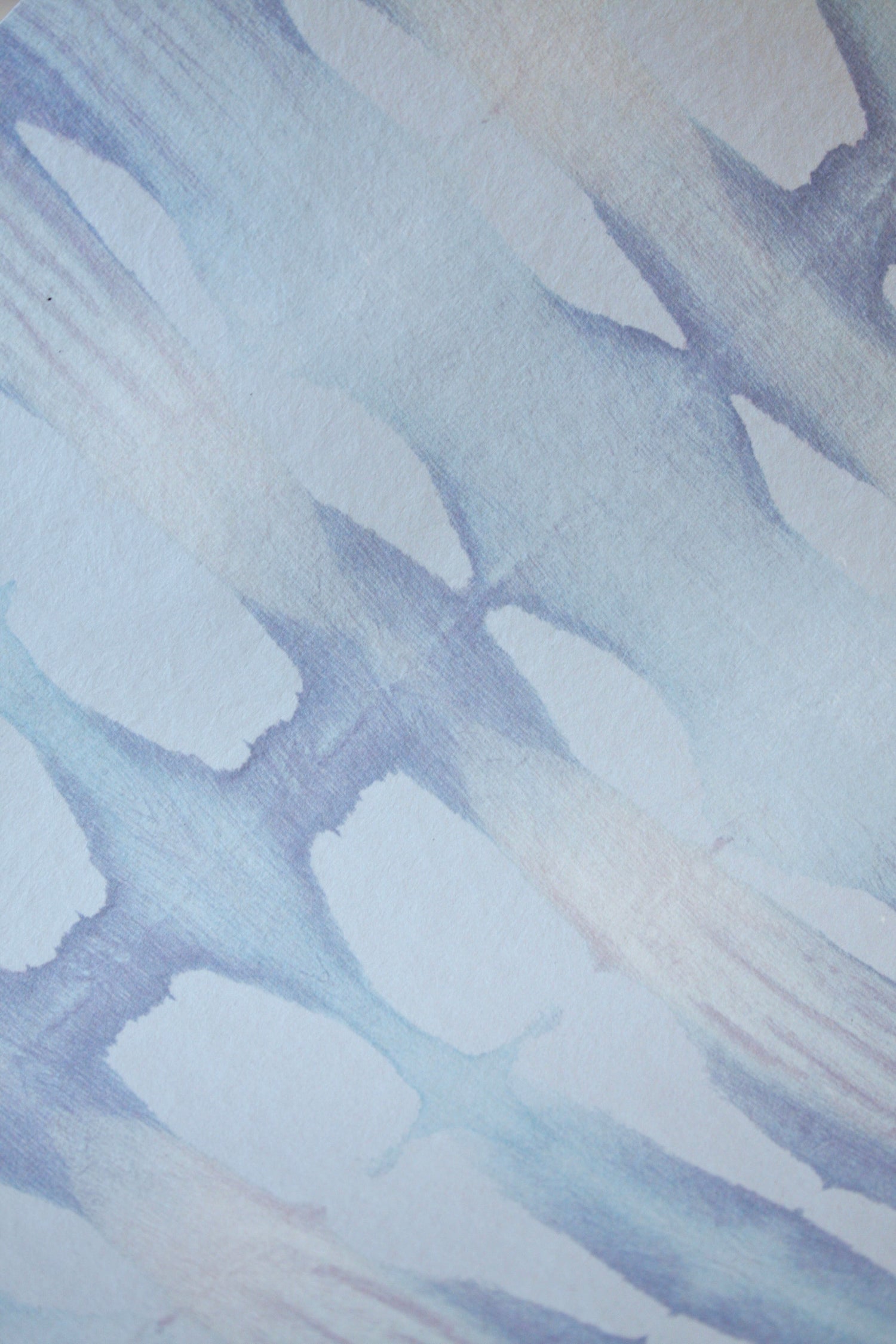 Abstract pattern of blue and white shapes on a textured background